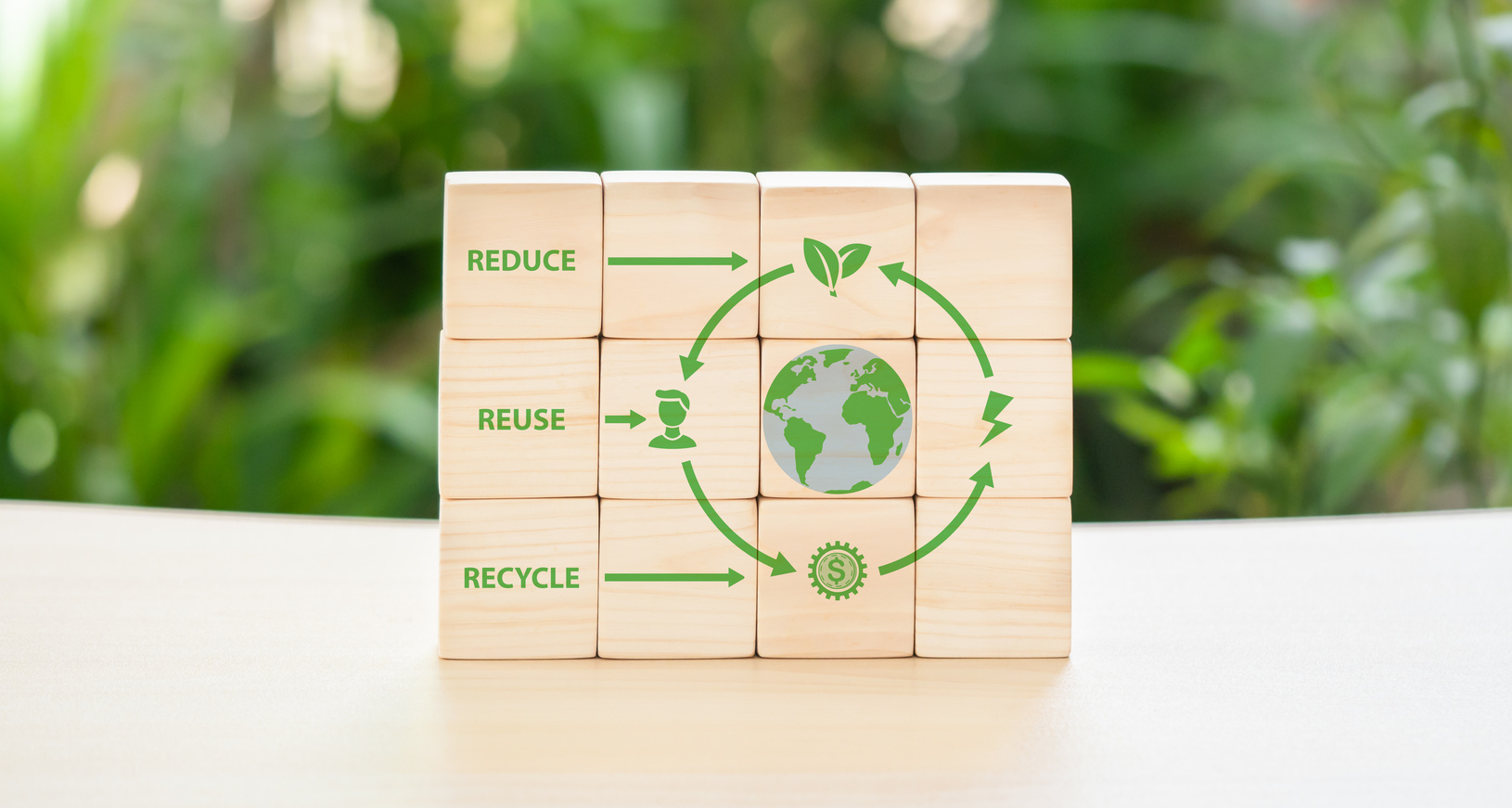 On green backdrop, the emblems of the cyclic economy. Recycling,